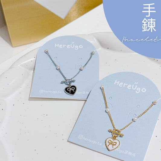 韓製。心型吊牌蝴蝶結LOGO手鍊（2色）